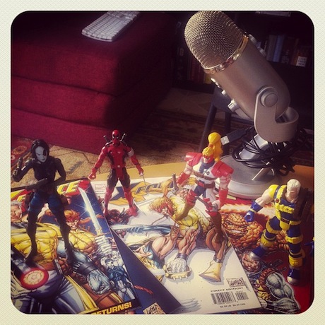 Still life photograph of a microphone and the X-Force action figures.