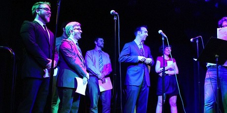 Photograph of the cast on stage.